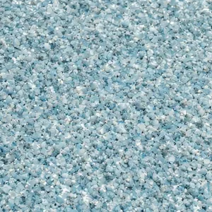 Close-up of a speckled light-blue quartz aggregate pool finish