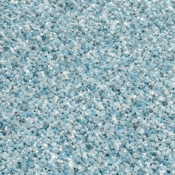Close-up of a speckled light-blue quartz aggregate pool finish